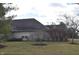 Home exterior with nice shrubbery and trees on a manicured lawn at 6725 Bridgefield Way # 1, Indianapolis, IN 46254