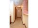 Hallway with wood floors leading to multiple rooms, features hanging storage at 6725 Bridgefield Way # 1, Indianapolis, IN 46254