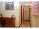 Hallway with wood floors leading to multiple rooms, features a wooden cabinet at 6725 Bridgefield Way # 1, Indianapolis, IN 46254