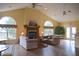 Spacious living room with a fireplace, ceiling fans, and vaulted ceilings at 6725 Bridgefield Way # 1, Indianapolis, IN 46254