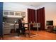 Office space with black desk chair, cabinetry, and red curtains at 6725 Bridgefield Way # 1, Indianapolis, IN 46254