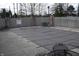 Outdoor pool secured with a winter safety cover and surrounded by brick patio at 6725 Bridgefield Way # 1, Indianapolis, IN 46254