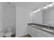 Bright bathroom featuring a double sink vanity with gray countertop at 7070 Nine Penny Dr, Brownsburg, IN 46112