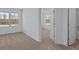 Bedroom featuring neutral carpet, light walls, and a view to other rooms at 7070 Nine Penny Dr, Brownsburg, IN 46112