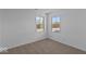 Bedroom with neutral carpet, light walls, and two windows for natural light at 7070 Nine Penny Dr, Brownsburg, IN 46112