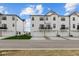 Modern townhomes with private garages and balconies in a contemporary neighborhood setting at 7070 Nine Penny Dr, Brownsburg, IN 46112