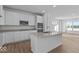 Modern kitchen featuring stainless steel appliances, quartz countertops and white cabinetry at 7070 Nine Penny Dr, Brownsburg, IN 46112