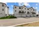 Modern townhomes with rear-entry garages and balconies, set in a well-maintained community at 7070 Nine Penny Dr, Brownsburg, IN 46112