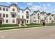 Charming row of modern townhomes with black trim, manicured lawns, and inviting curb appeal at 7070 Nine Penny Dr, Brownsburg, IN 46112