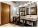 Bright bathroom features double sink vanities, modern fixtures, and stylish mirrors at 735 Lexington Ave # 1, Indianapolis, IN 46203