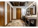 Stylish bathroom featuring double sinks and attractive tile flooring, with multiple doors at 735 Lexington Ave # 1, Indianapolis, IN 46203