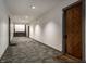 Hallway with carpet flooring, several doors, and stairs to the second level at 735 Lexington Ave # 1, Indianapolis, IN 46203