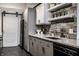 Modern kitchen with gray cabinets, white countertops, and stainless steel appliances plus a sliding barn door at 735 Lexington Ave # 1, Indianapolis, IN 46203