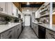 Modern kitchen with stainless appliances, tile floors, two-tone cabinets and an industrial style at 735 Lexington Ave # 1, Indianapolis, IN 46203