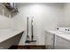 Laundry room with white washer and dryer, folding table and wire shelving at 735 Lexington Ave # 1, Indianapolis, IN 46203
