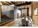 Expansive living room with exposed brick, hardwood floors, and bright natural light at 735 Lexington Ave # 1, Indianapolis, IN 46203