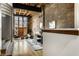 Inviting living room with exposed brick, hardwood floors, and lofted ceilings at 735 Lexington Ave # 1, Indianapolis, IN 46203