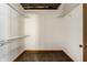 Empty walk-in closet with built-in shelving and wood trim at 735 Lexington Ave # 1, Indianapolis, IN 46203