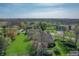 Aerial view of a home with a lush lawn and established trees at 7472 Windridge Way, Brownsburg, IN 46112