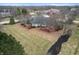 Aerial view showcases the home's large lot, mature trees and a spacious backyard with a deck at 7472 Windridge Way, Brownsburg, IN 46112