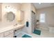 Comfortable bathroom featuring an accessible vanity, neutral walls, and a shower at 7472 Windridge Way, Brownsburg, IN 46112