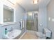 Well-lit bathroom featuring a shower, toilet, and vanity with a sink and neutral-toned accents at 7472 Windridge Way, Brownsburg, IN 46112