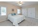 Bright bedroom with a queen bed, carpet, and two large closets at 7472 Windridge Way, Brownsburg, IN 46112