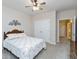 Comfortable bedroom featuring patterned bedding, natural light, and a closet at 7472 Windridge Way, Brownsburg, IN 46112