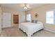 Bright bedroom features a queen bed, natural light, and adjoins the bathroom at 7472 Windridge Way, Brownsburg, IN 46112
