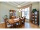 Formal dining room featuring a large wooden table, elegant chandelier, and beautiful decor at 7472 Windridge Way, Brownsburg, IN 46112