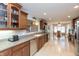 Spacious kitchen featuring wood cabinets, stainless steel appliances, and tile flooring at 7472 Windridge Way, Brownsburg, IN 46112