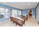 Relaxing living room with large windows, neutral furniture, and access to the patio at 7472 Windridge Way, Brownsburg, IN 46112
