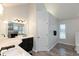 Bright main bathroom with double vanity, black fixtures, and tile flooring at 7472 Windridge Way, Brownsburg, IN 46112