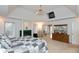 Bright main bedroom with a fireplace, tray ceiling, and sliding glass doors leading to the patio at 7472 Windridge Way, Brownsburg, IN 46112