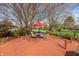Relaxing backyard deck features an umbrella table and chairs, providing a perfect space for outdoor enjoyment at 7472 Windridge Way, Brownsburg, IN 46112