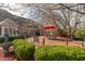 The backyard deck, with a table setting and seating, extends entertainment to the outdoors at 7472 Windridge Way, Brownsburg, IN 46112