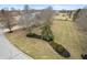 Aerial view of a large landscaped yard with mature trees and manicured lawn, showcasing outdoor space at 7472 Windridge Way, Brownsburg, IN 46112