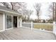 Outdoor back deck with white railing and sliding glass door access at 8001 N Illinois St, Indianapolis, IN 46260