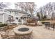 Beautiful backyard with a cozy fire pit, deck, and screened-in porch for outdoor enjoyment at 8001 N Illinois St, Indianapolis, IN 46260