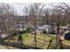 Private backyard with a lovely patio area, enclosed porch, lush green lawn, and trees, offering a serene outdoor living space at 8001 N Illinois St, Indianapolis, IN 46260