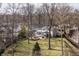 Beautiful backyard featuring a patio, screened-in porch, manicured lawn and mature trees offering both space and privacy at 8001 N Illinois St, Indianapolis, IN 46260