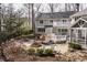 Stunning backyard featuring a stone patio with a built-in fire pit, lovely landscaping and manicured grounds at 8001 N Illinois St, Indianapolis, IN 46260