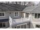 A great view of the outdoor balcony showcasing white railings, sliding glass doors and outdoor lighting at 8001 N Illinois St, Indianapolis, IN 46260