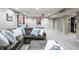 Finished basement with a sectional sofa and movie posters at 8001 N Illinois St, Indianapolis, IN 46260