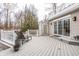 Backyard deck with wood decking, outdoor seating, and garden pots at 8001 N Illinois St, Indianapolis, IN 46260