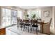 Bright dining room with sliding glass doors, and a view of the backyard at 8001 N Illinois St, Indianapolis, IN 46260