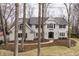 Beautiful two-story home exterior featuring a classic design with well-manicured lawn at 8001 N Illinois St, Indianapolis, IN 46260