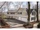 Charming two-story house featuring an attached two-car garage, white trim and dark shutters at 8001 N Illinois St, Indianapolis, IN 46260