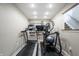 Basement gym with treadmill, elliptical machine and weights at 8001 N Illinois St, Indianapolis, IN 46260