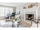 Elegant living room with fireplace, a piano, and plenty of natural light at 8001 N Illinois St, Indianapolis, IN 46260